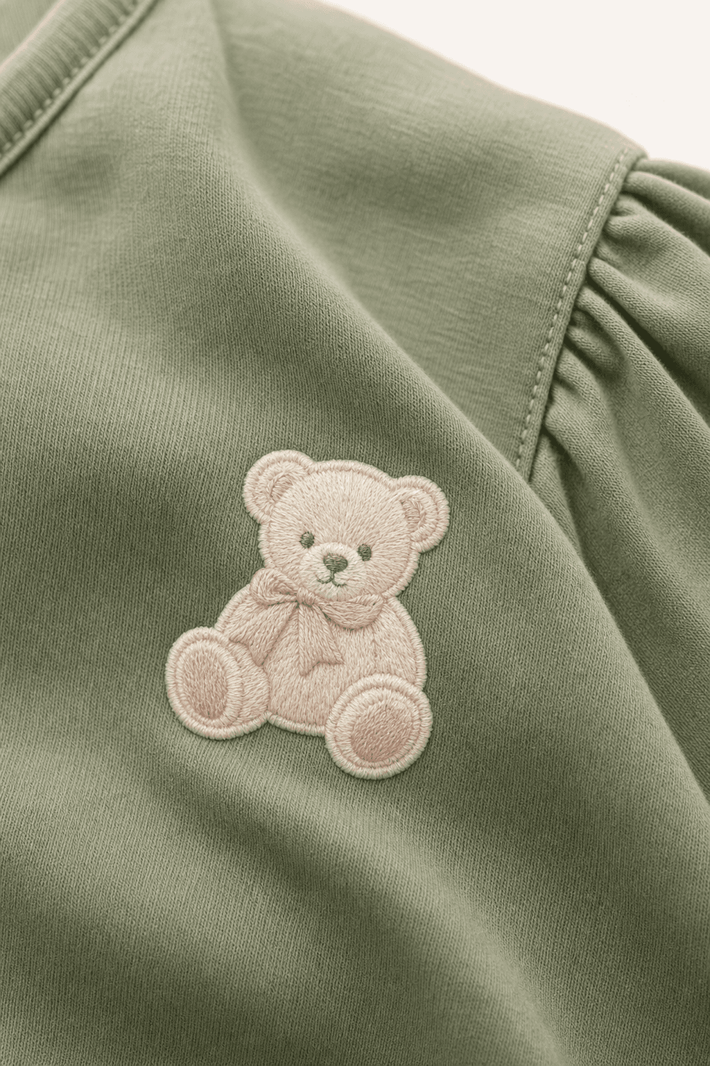 Close-up of the bear appliqué on the jersey set